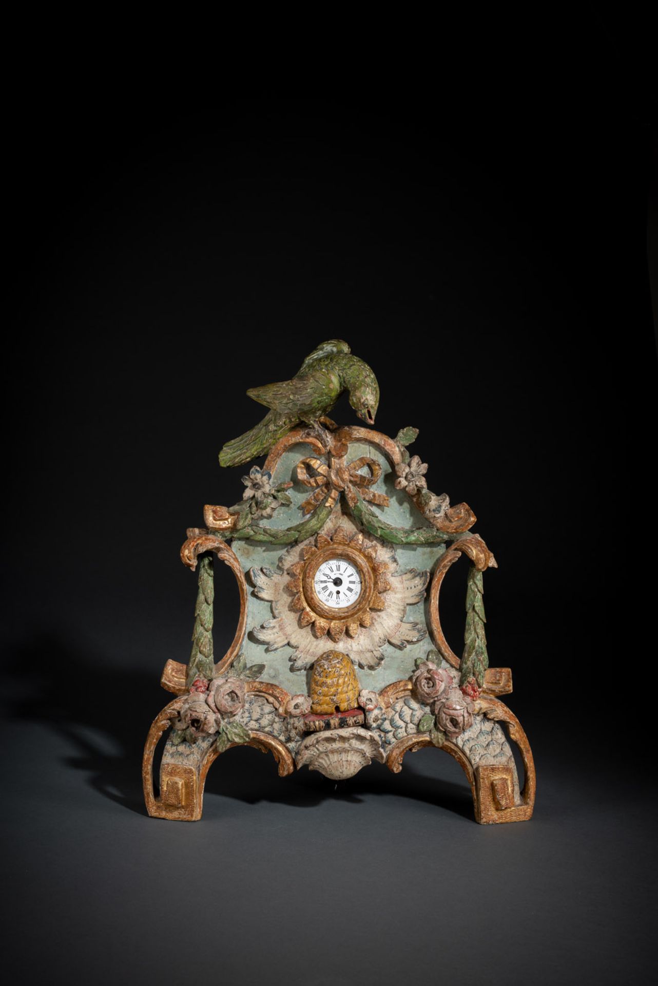 A FINE CARVED WOOD ROCOCO WATCH STAND WITH PARROT