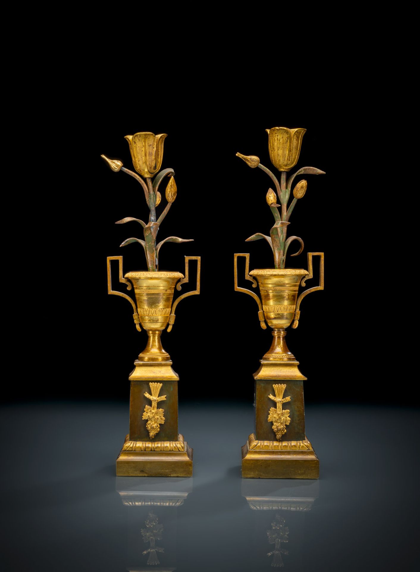 A PAIR OF ORMOLU AND PAINTED BRONZE EMPIRE CANDLESTICKS
