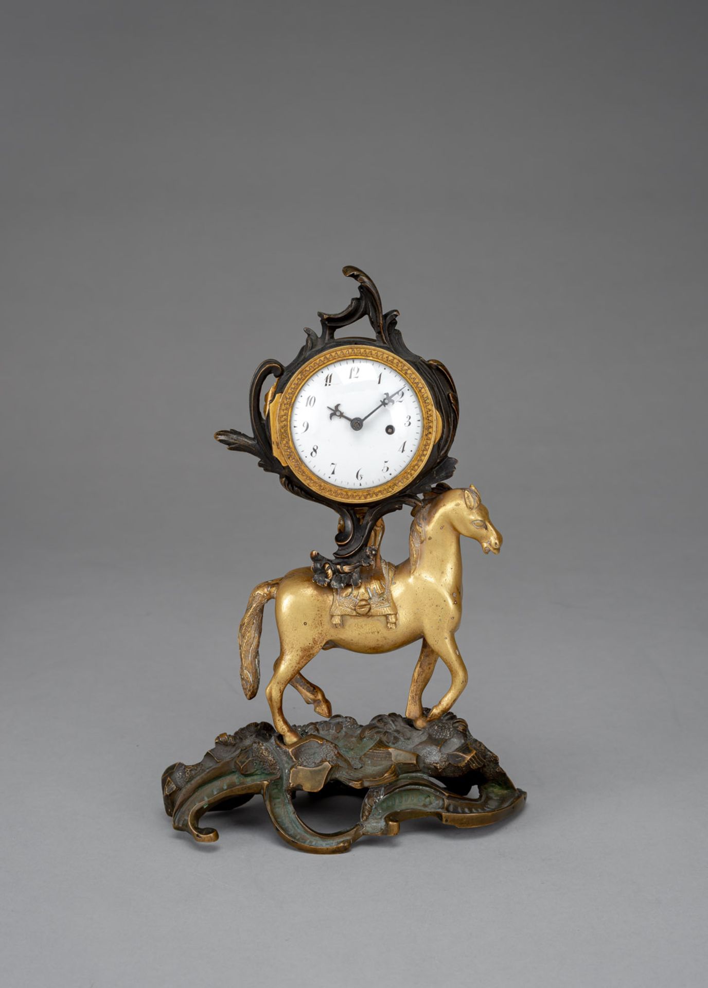 A GERMAN ROCOCO BRONZE TABLE TIMEPIECE WITH HORSE