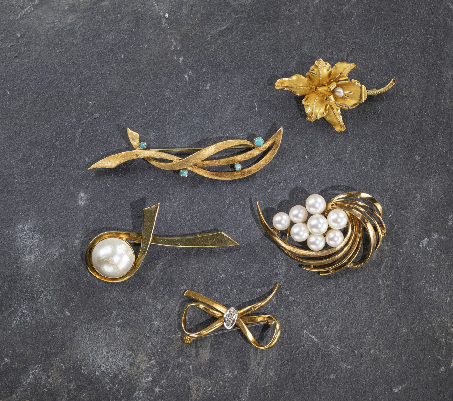 FIVE GOLD BROOCHES