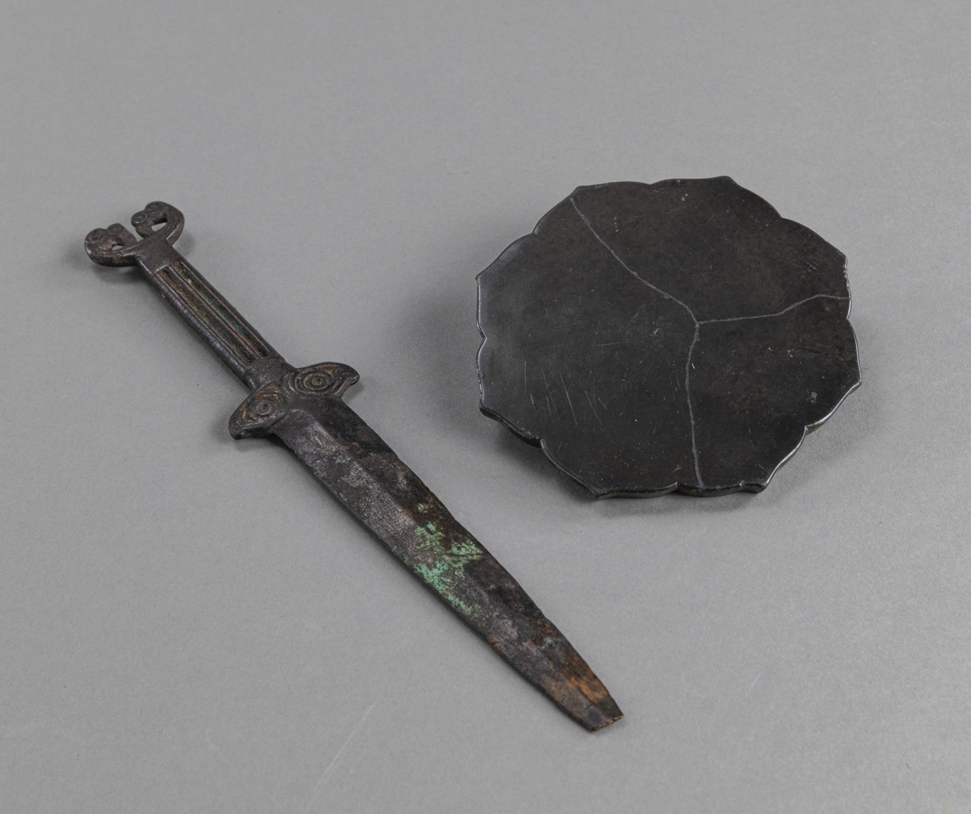 AN EIGHT-LOBED FLORAL BRONZE MIRROR AND A BRONZE DAGGER - Image 2 of 2