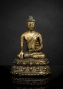 A FINE AND EARLY BRONZE FIGURE OF GAUTAMA BUDDHA WITH COPPER INLAYS