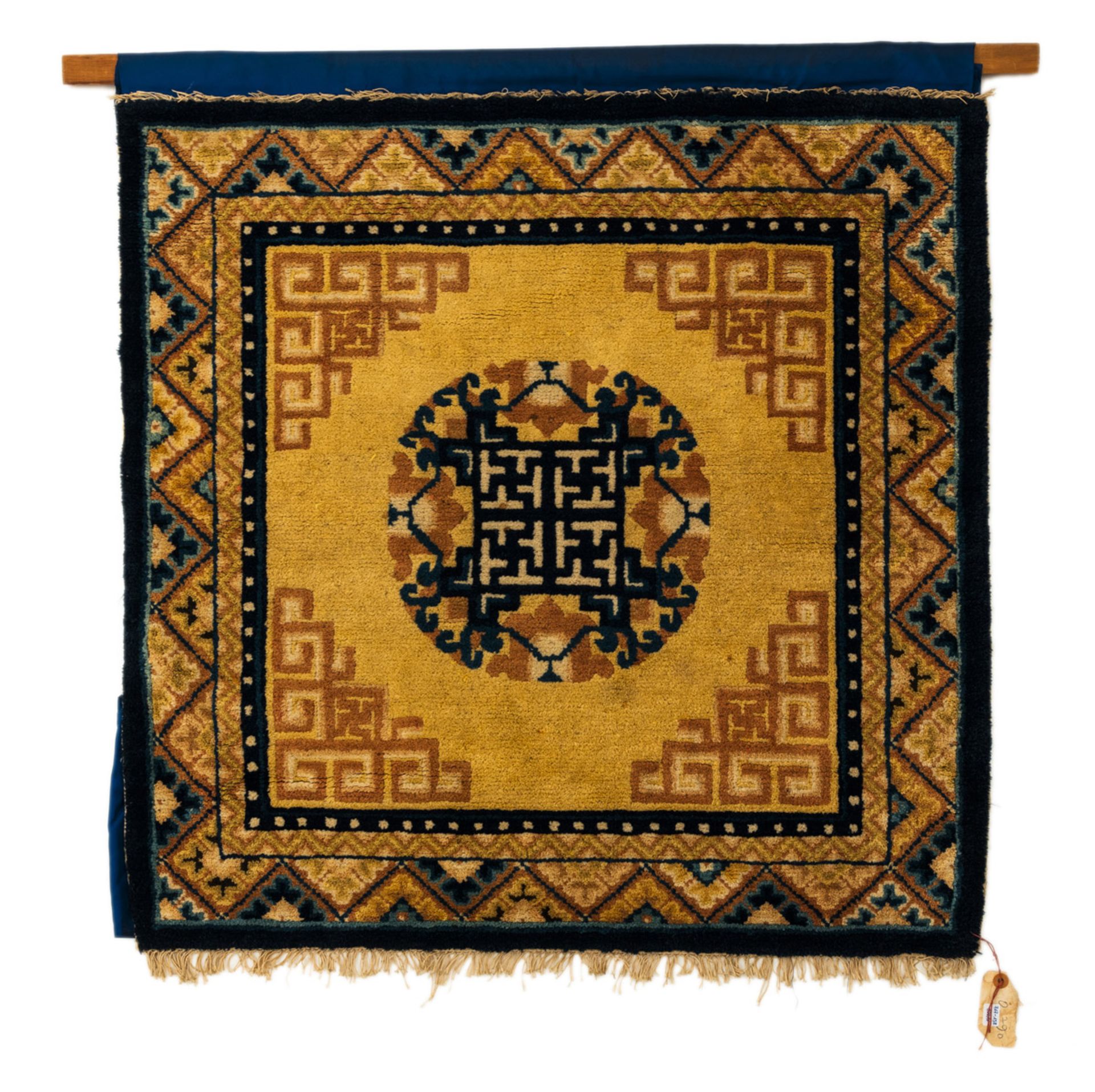 COLORED WOOL SEAT CARPET WITH A MEDALLION AND GEOMETRIC PATTERNS ON A YELLOW BACKGROUND