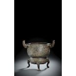 A BRONZE TRIPOD CENSER IN ARCHAIC STYLE WITH TAOTIE AND ELEPHANT HANDLES