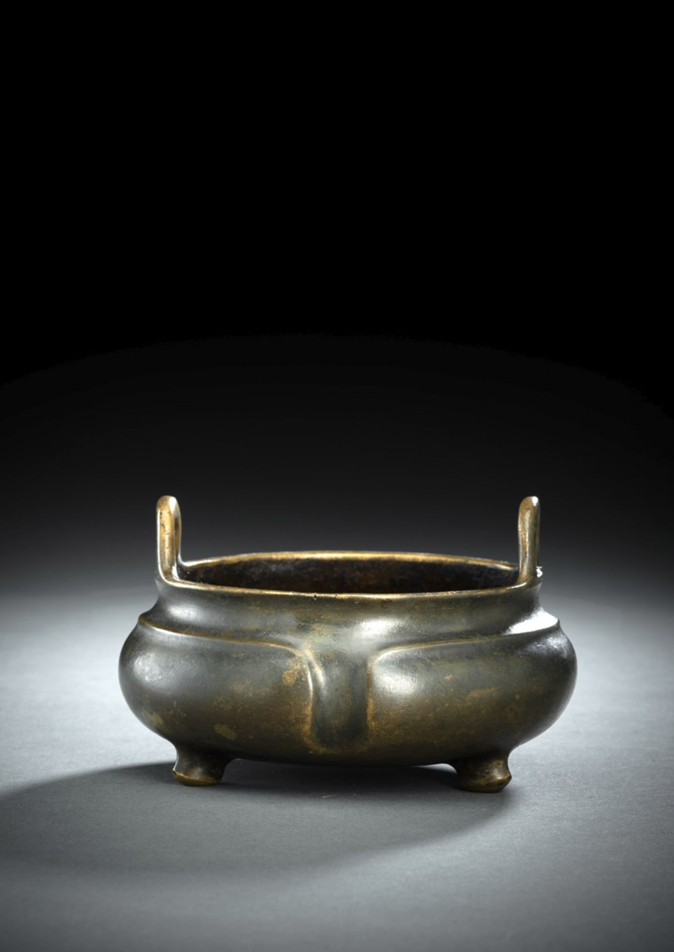 A BRONZE TRIPOD CENSER