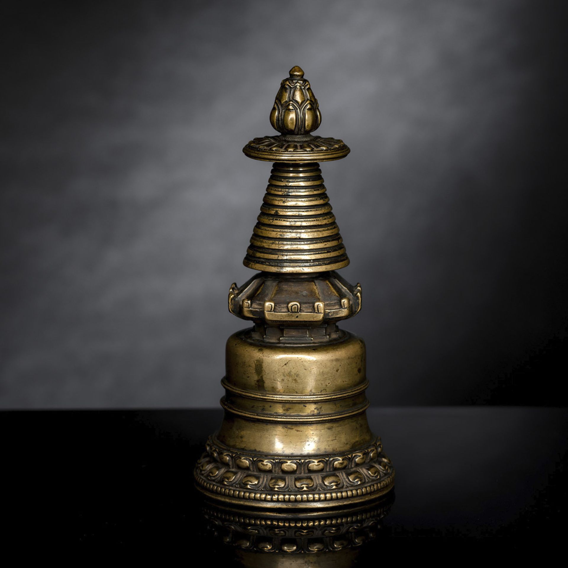 A FINE BRONZE STUPA