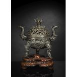 A BRONZE ELEPHANT AND LOTUS TRIPOD CENSER ON WOOD STAND