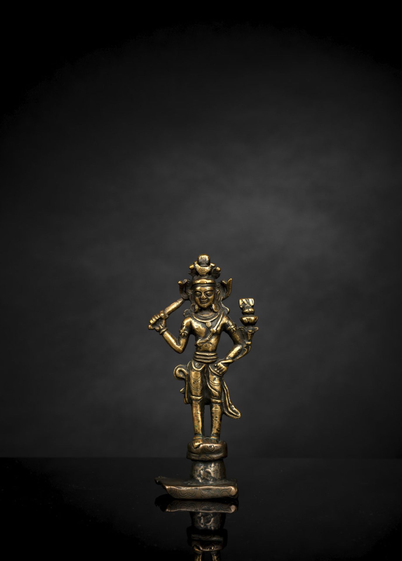 A BRONZE FIGURE OF MANJUSHRI,