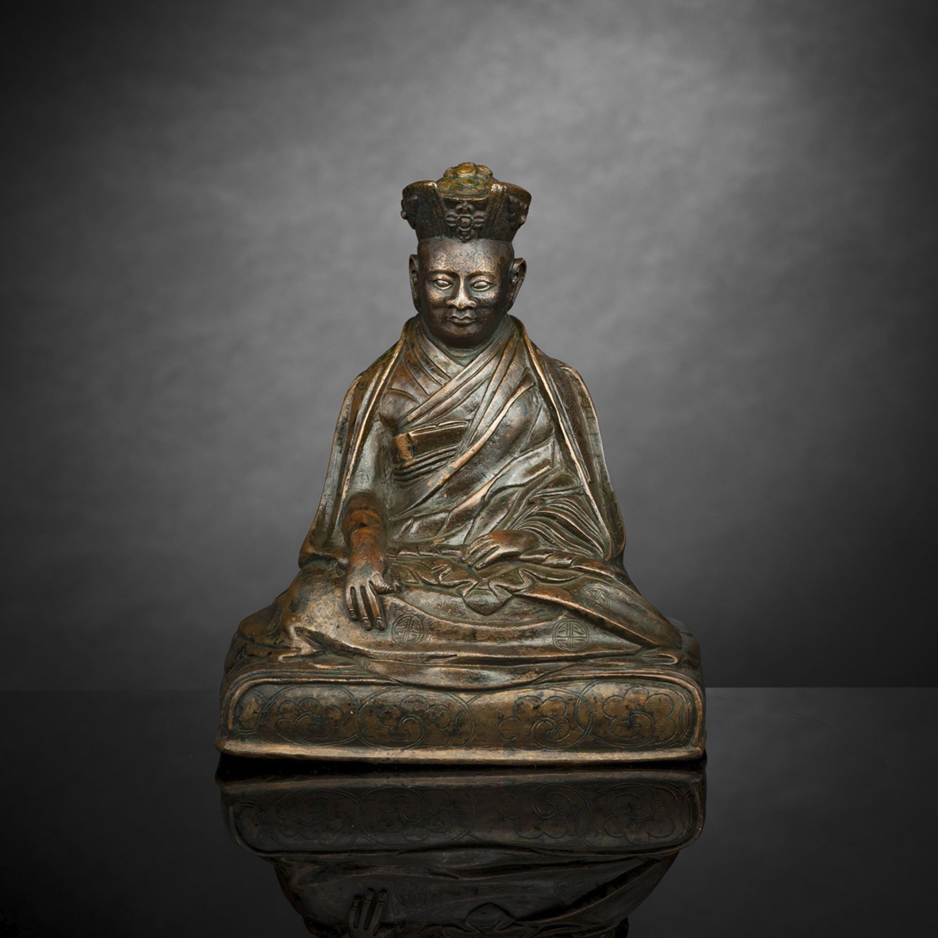 A BRONZE FIGURE OF A KARMAPA LAMA