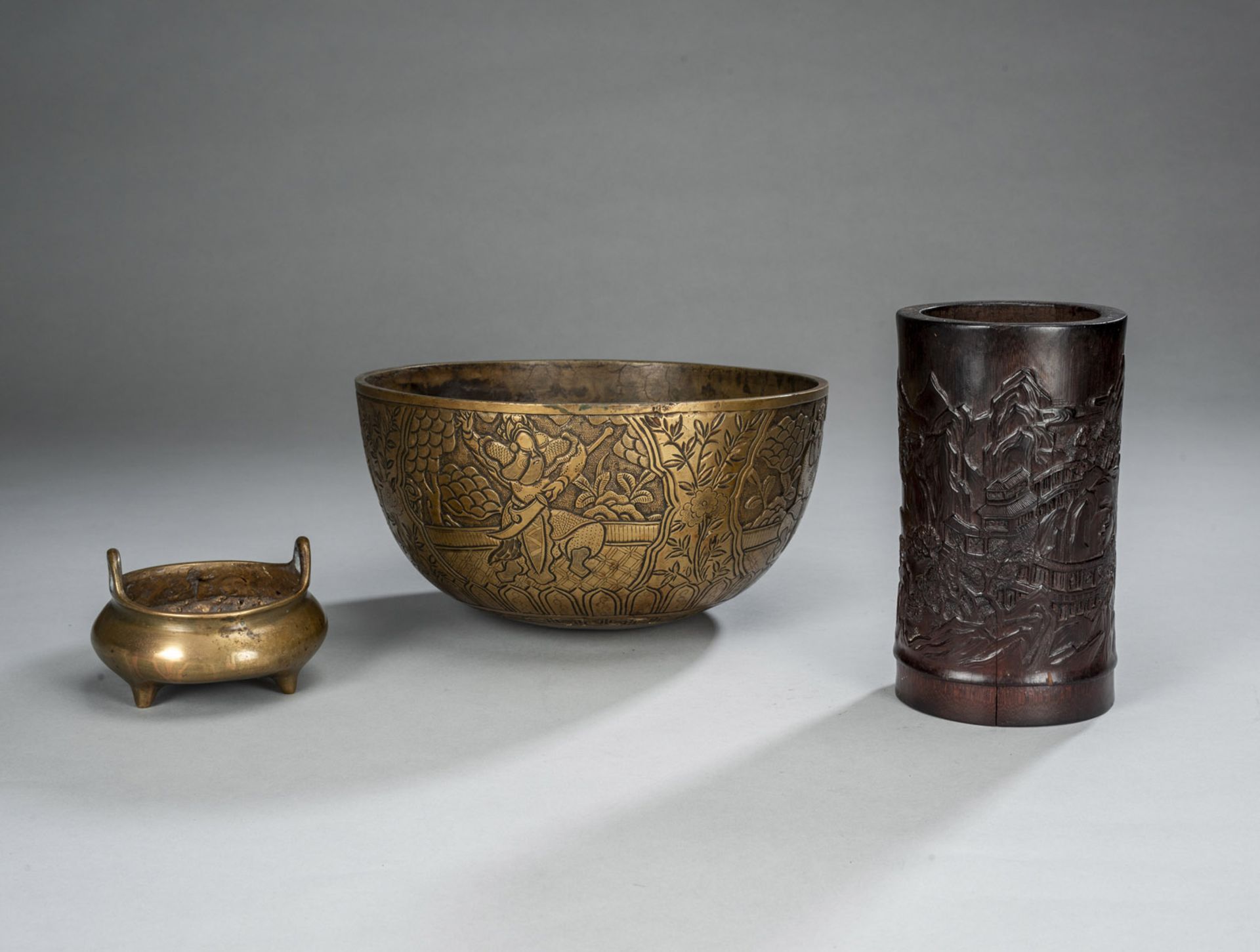 A BRONZE BOWL, A BRONZE INCENSE AND A BAMBOO BRUSH POT WITH A LAKE LANDSCAPE IN RELIEF