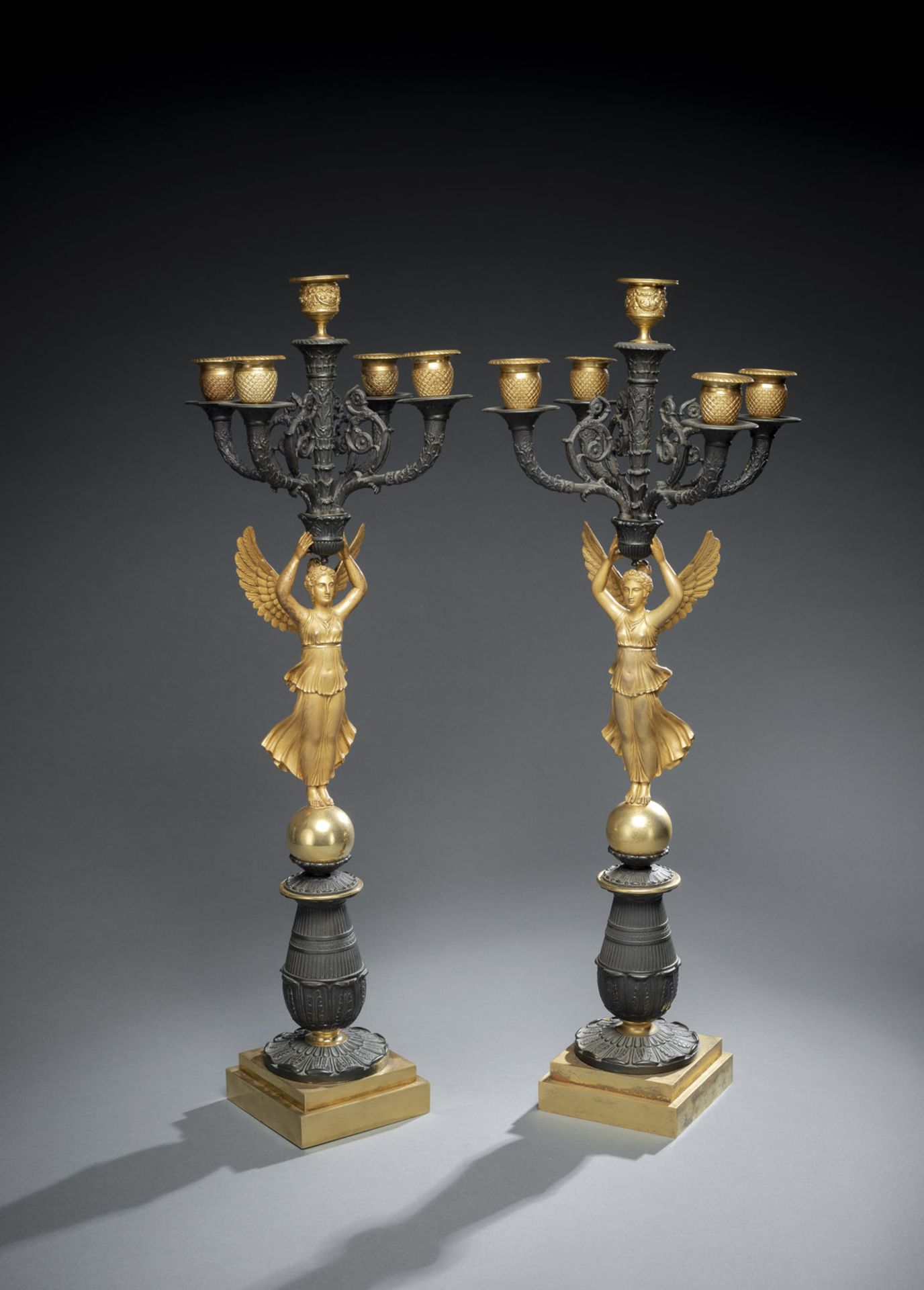 A PAIR OF FRENCH CHARLES X ORMOLU AND PAINTED BRONZE FIVE LIGHT CANDELABRA