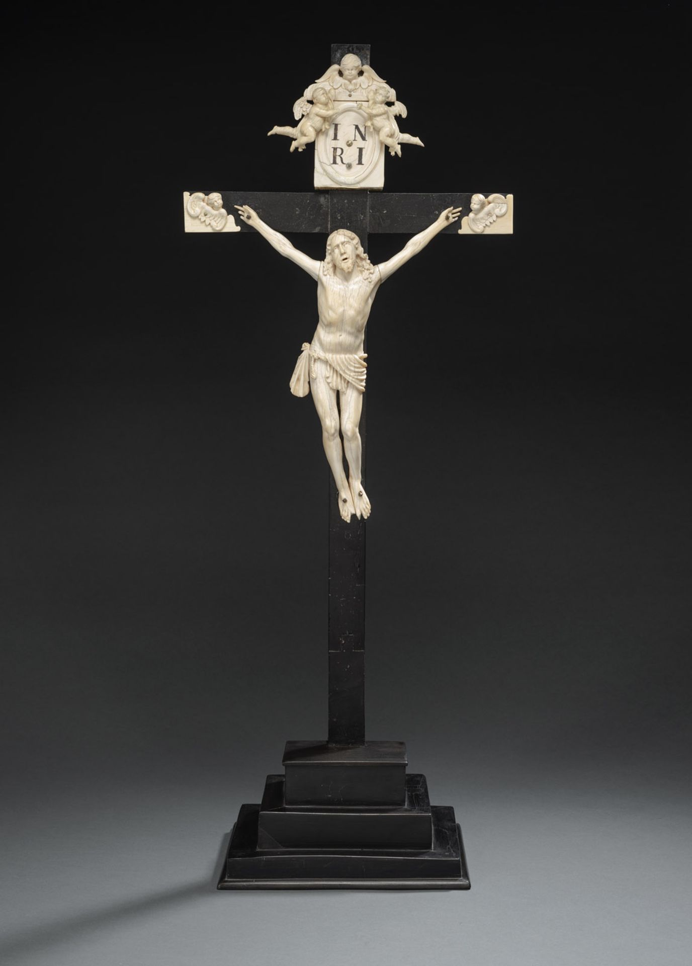 AN IVORY AND EBONIZED WOOD CRUCIFIX