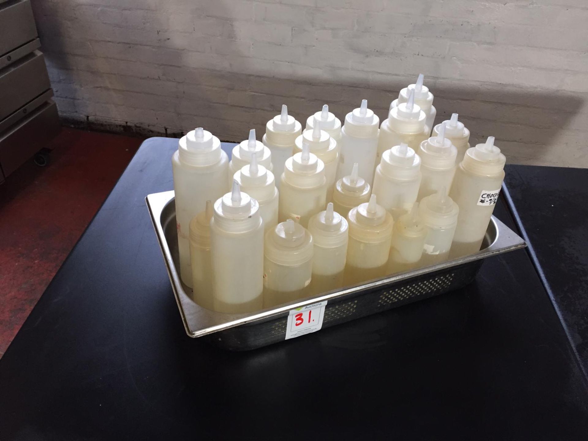 Stainless Steel Tray Containing Sauce Bottles