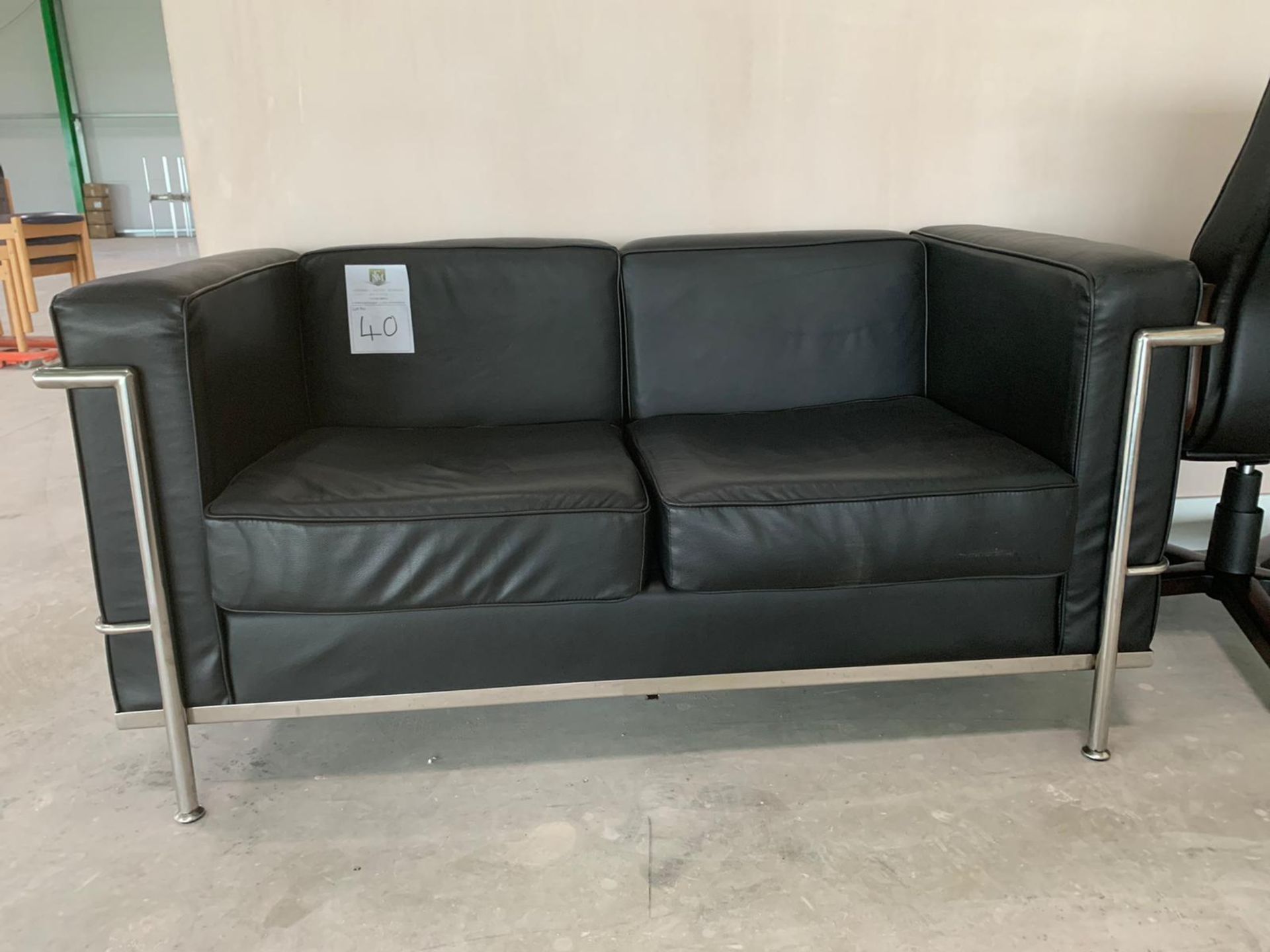 Black Leather Two Seater Sofa with Chrome Legs