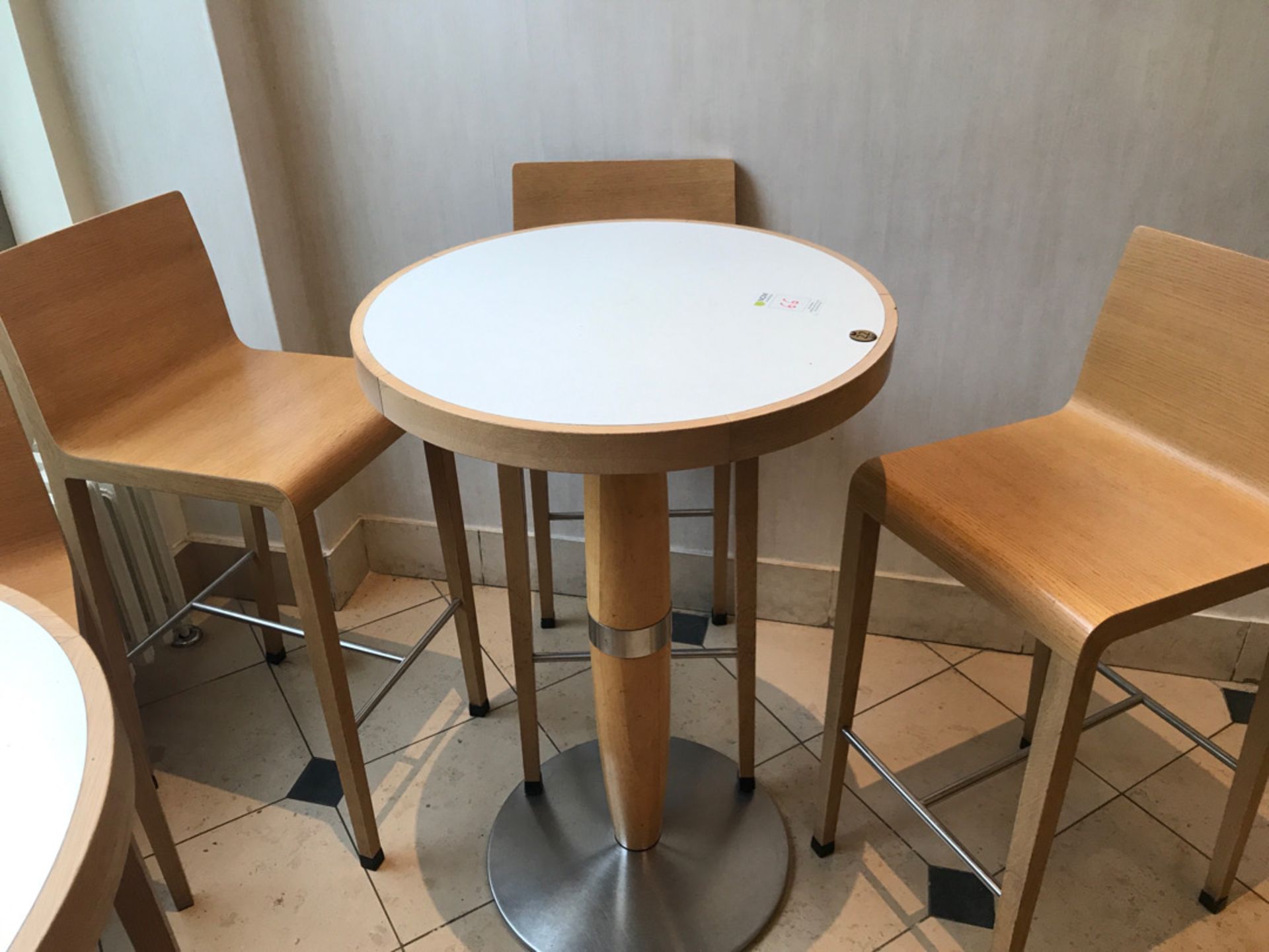 Tall pedestal table with three stool chairs
