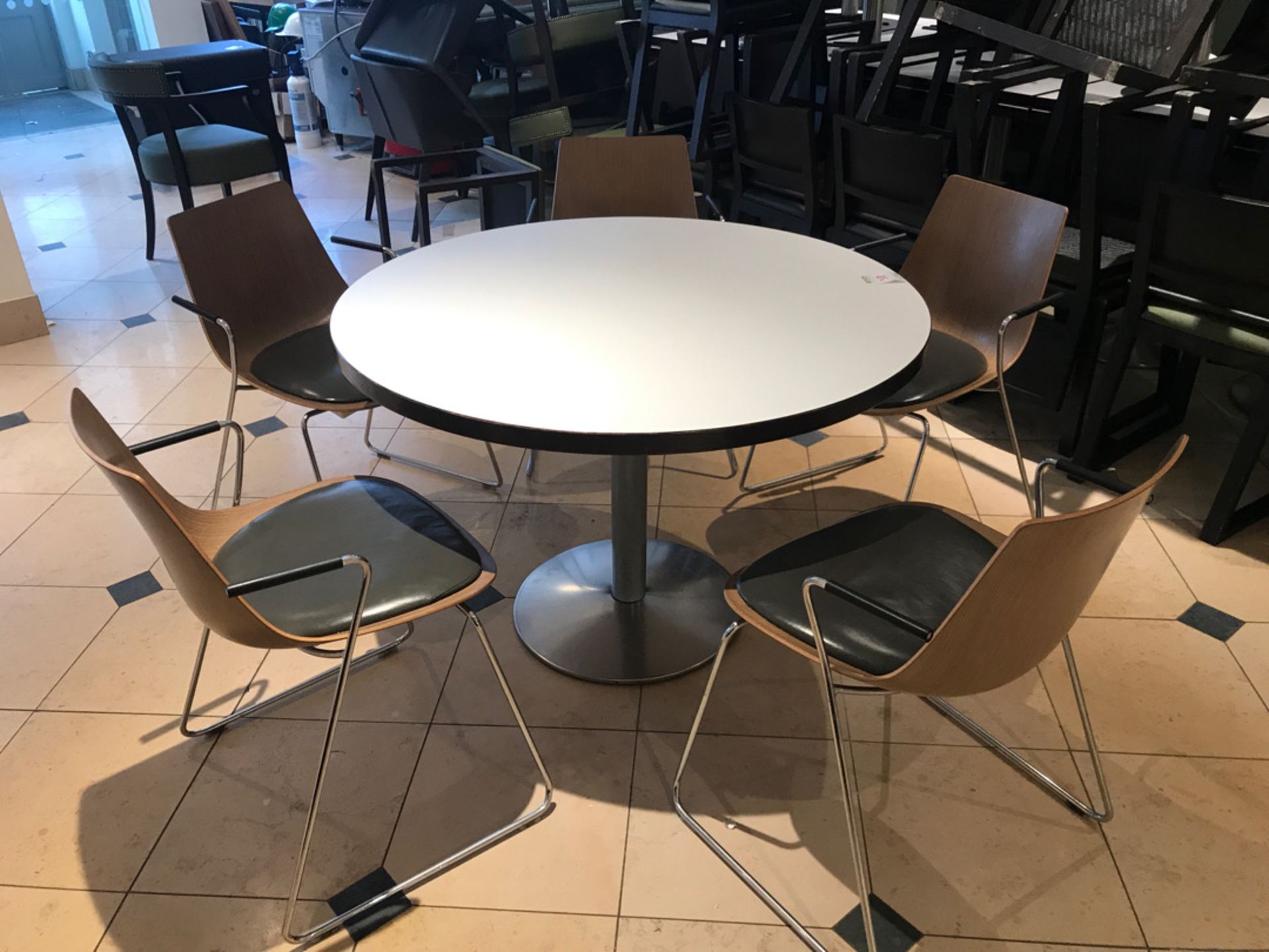 Large pedestal table with five designer modern chairs