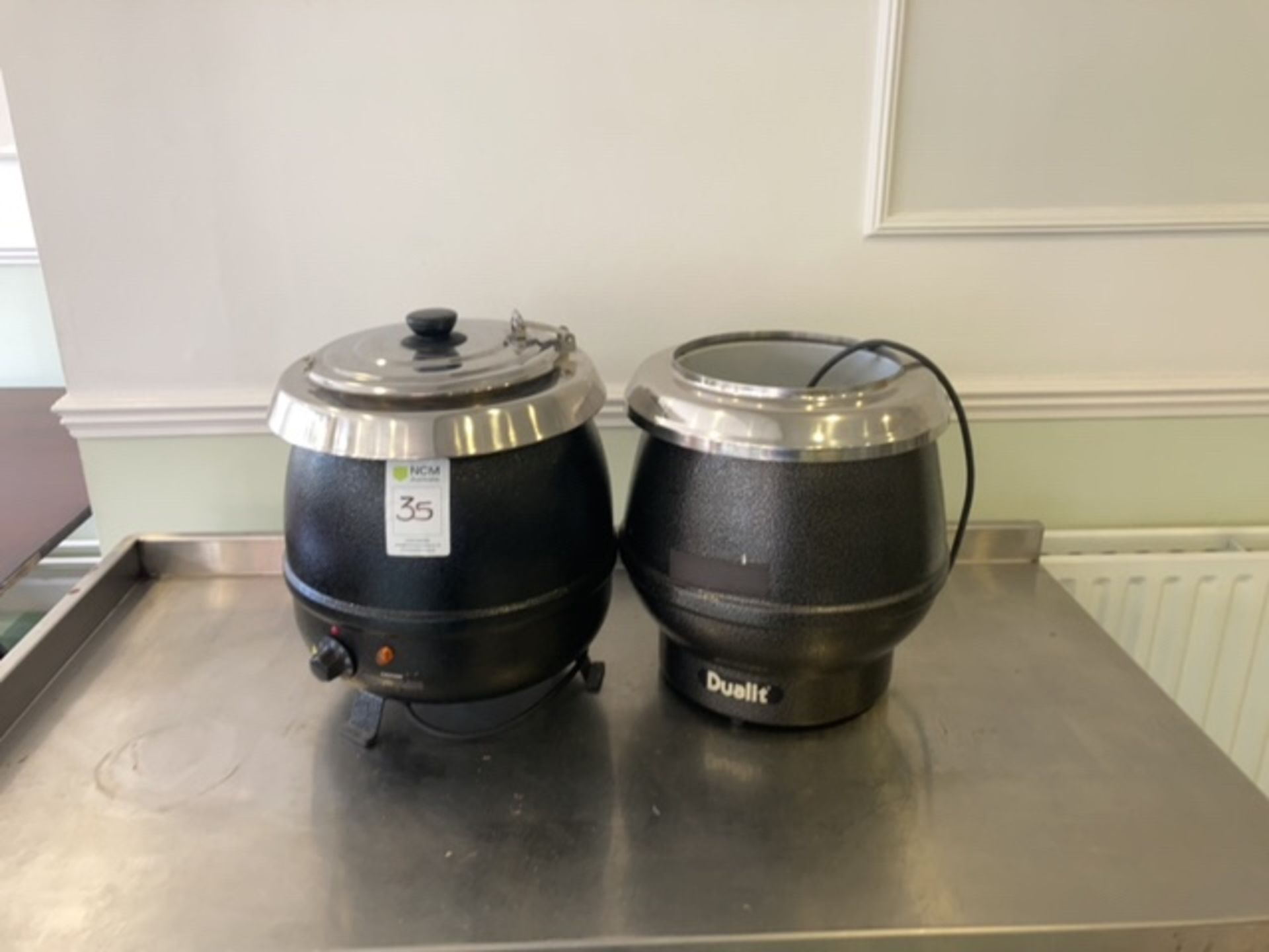 A pair of soup kettles