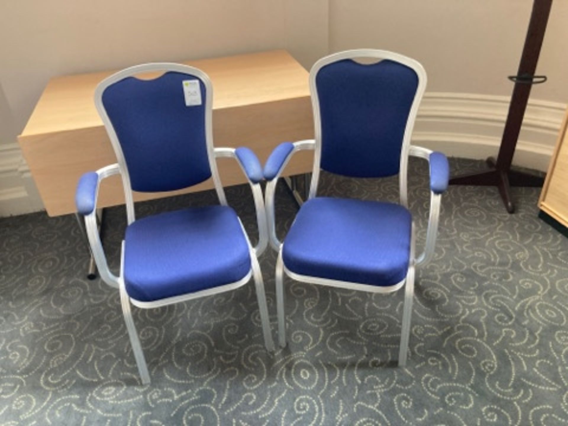 A quantity of Burgess stacking conference room chairs with arms