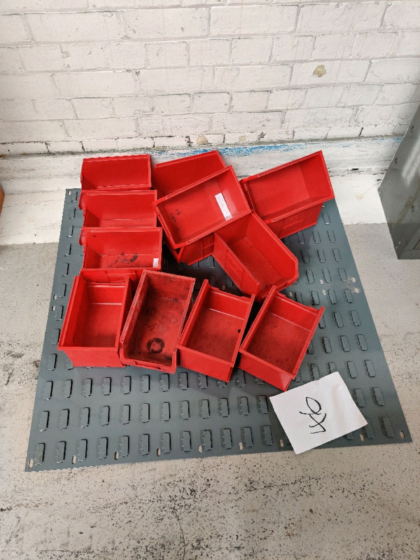 Wall rack with red bin holders storage