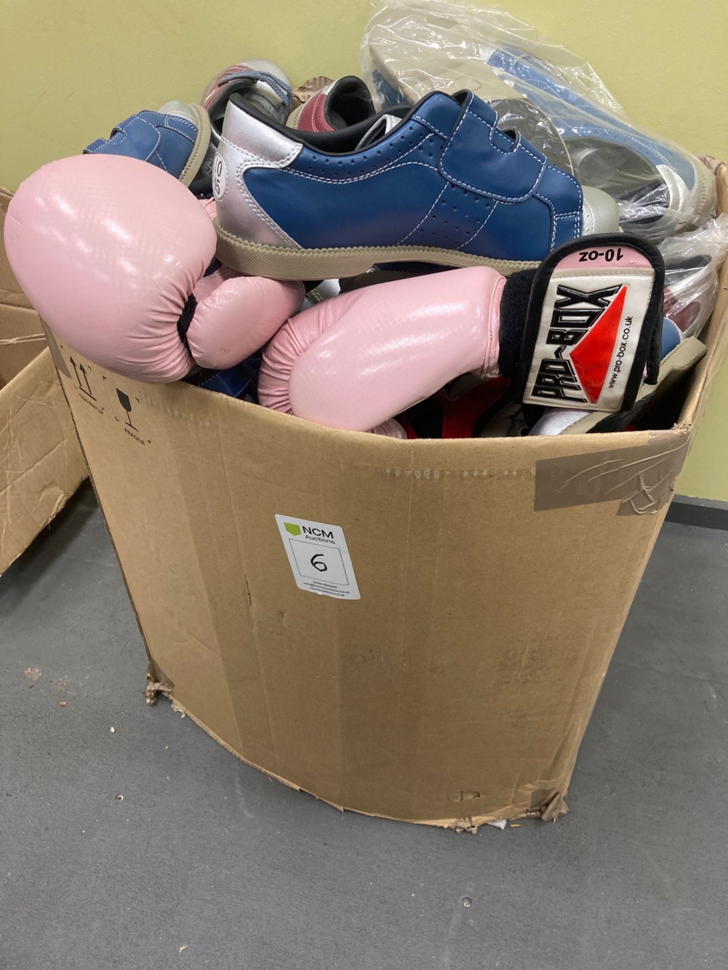 Large box of Bowling alley shoes boxing gloves and