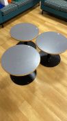 3 grey round tables