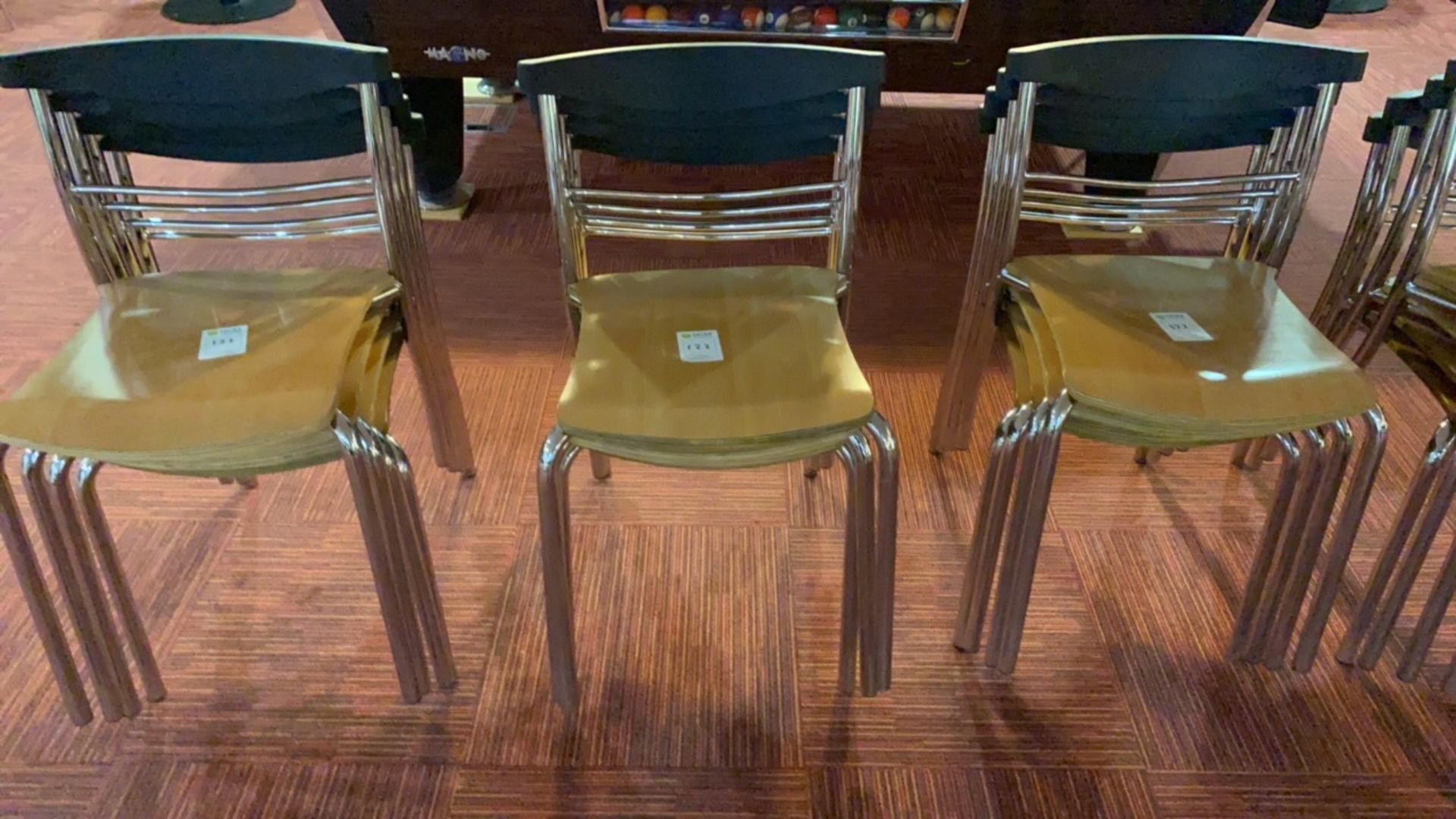 Stack of 4 wooden chairs