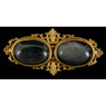 Prächtige 14 K Gelbgold-Brosche mit zwei Obsidian-Cabochons besetzt, ungepunzte Fassung, Historismu