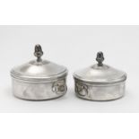 Two lidded tureens and a pair of oval platters