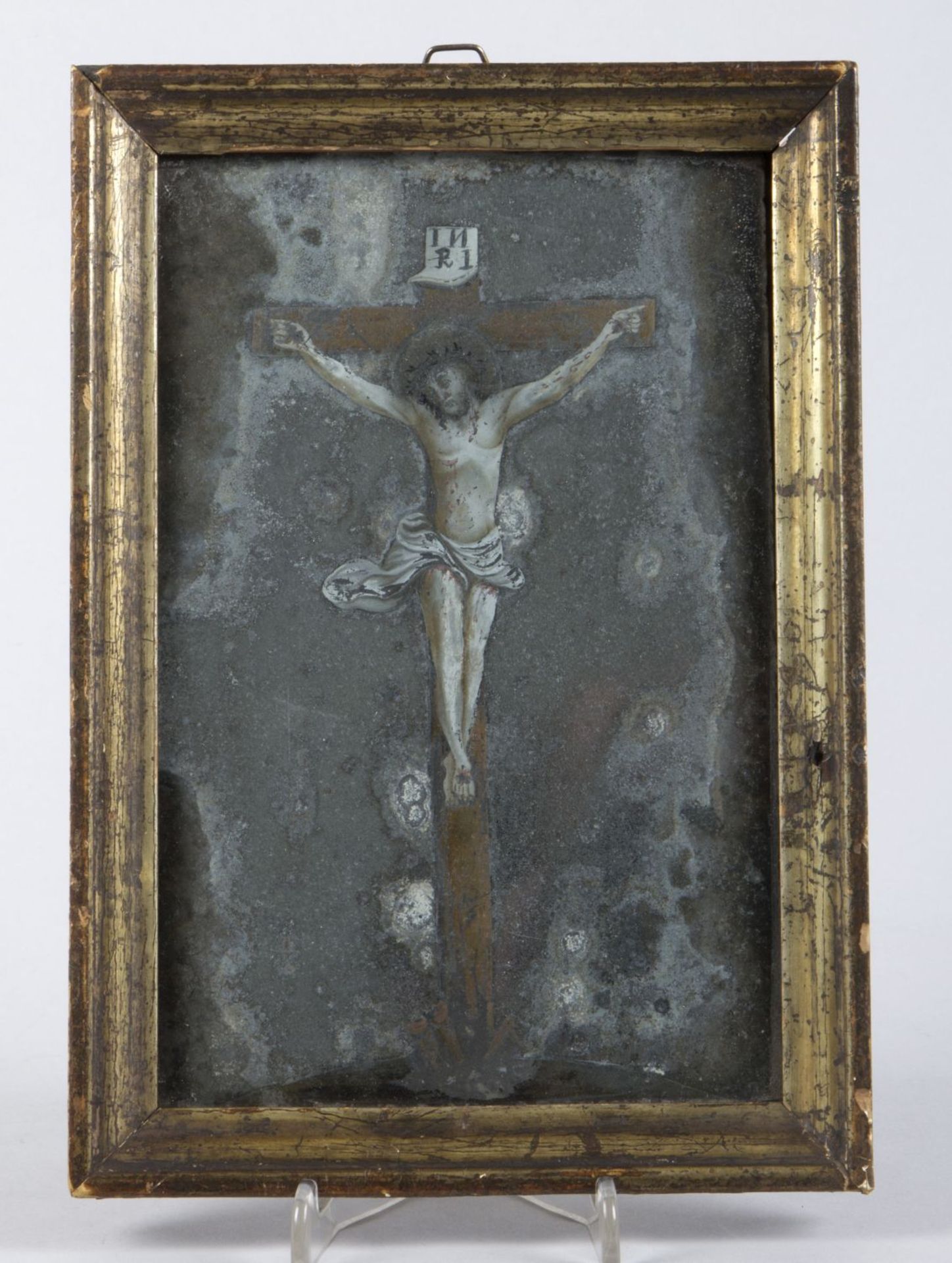 Nonnenspiegel Hinterglasbild. Tempera auf Glas. Darstellung Christi am Kreuz. Südd., 18. Jh.