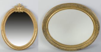 Zwei Wandspiegel Nadelholz. Goldfassung. Profilierte ovale Rahmen. 1 Ex. oberseitig mit Blatt