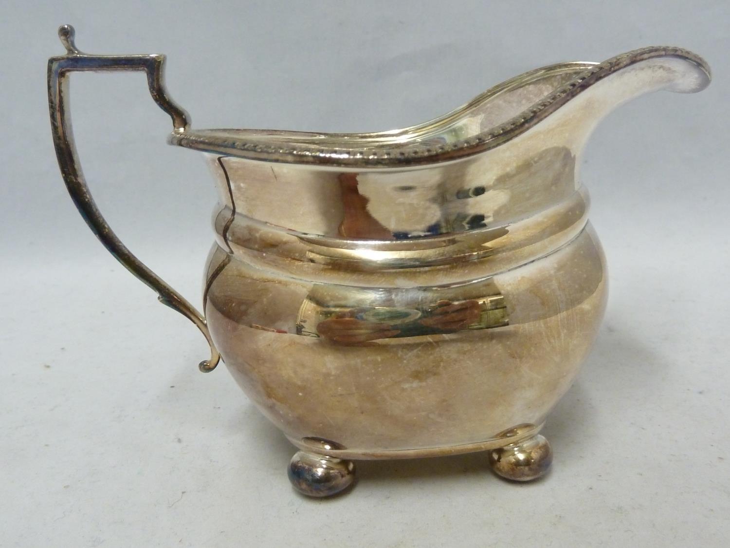An Adie Brothers Limited silver plated tea service, comprising, teapot with hinged cover, milk jug - Image 9 of 10
