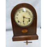 A Gilbert arch top chiming mantel clock, mahogany veneer case with marquetry paterae, with key and