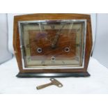 Enfield Clock Co (London) Limited - An Art Deco Chiming mantel clock, with marquetry case, dial