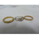 3 rings - one white metal with diamond chips, marked 925 DIA, ring size P; and two gilded metal