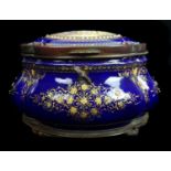 A Limoges enamelled metal casket and cover of quatrefoil bombe form, the deep cobalt blue ground