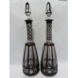 Bohemian - a large pair of mallet form glass decanters of deep ruby overlay cut through to