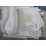 A quantity of Vintage tablecloths and linens, mostly lace edged includes traycloth, runner,