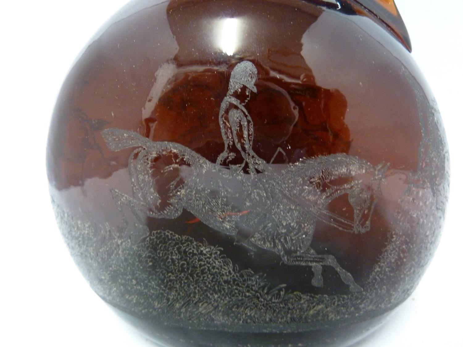 A P Haag, engraver - a 19th Century brown glass finger loop bottle decanter, engraved with a hunting - Image 2 of 8