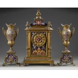 A GILT BRONZE AND CHAMPLEVÉ ENAMEL CLOCK SET