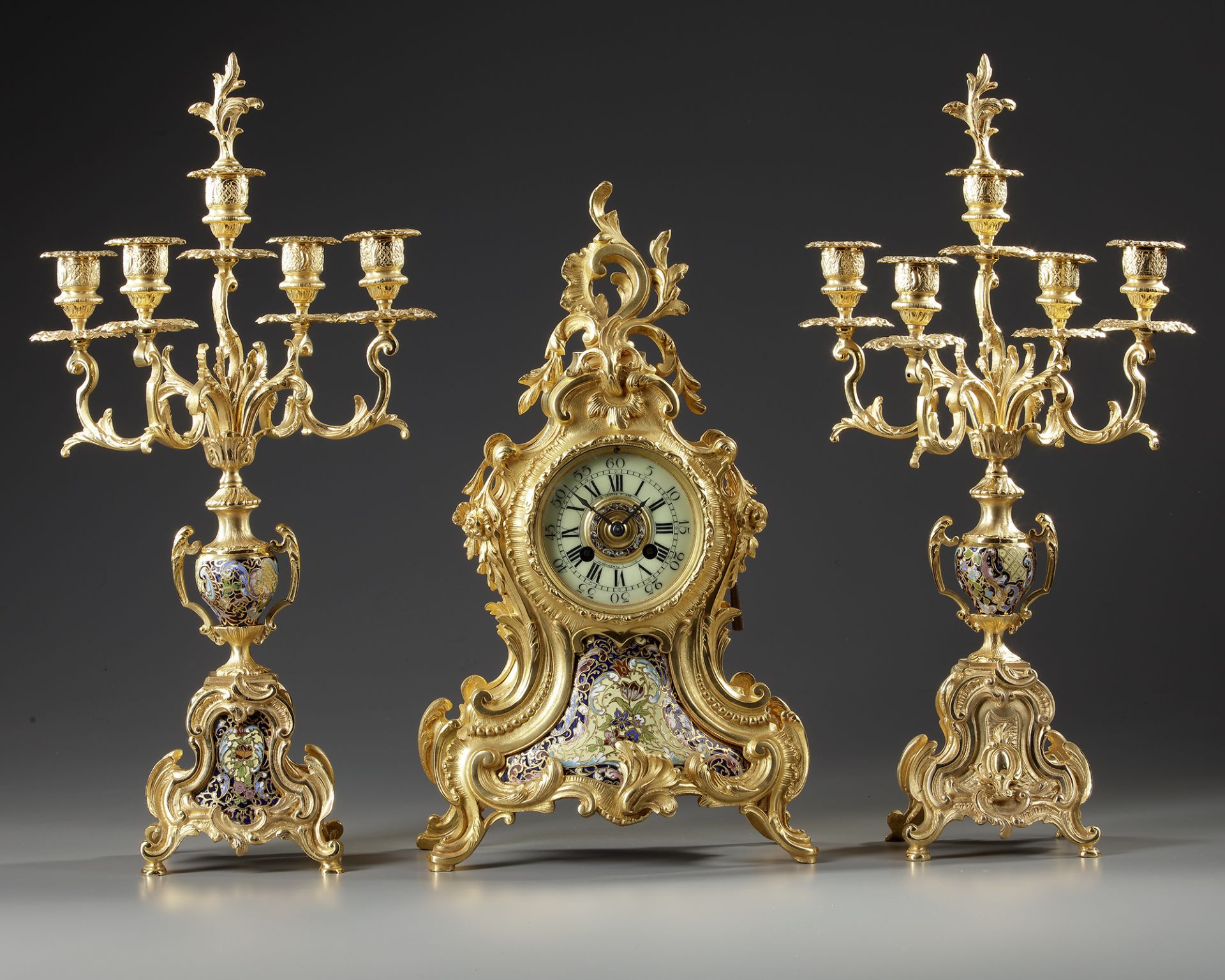 A FRENCH CHAMPLEVÉ ENAMEL CLOCK SET, 19TH CENTURY