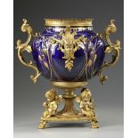 A FRENCH GILT SPELTER AND BLUE PORCELAIN FLOWER POT, LATE 19TH CENTURY