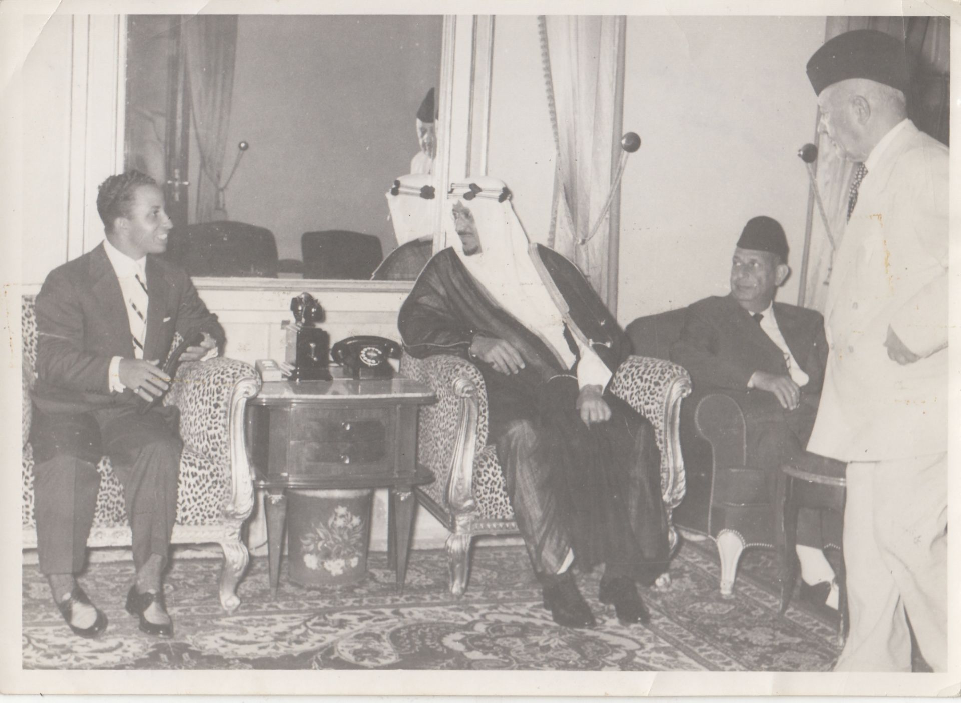 FOUR RARE PHOTOGRAPHS OF THE KINGS FAISAL II OF IRAQ AND SAUD BIN ABD AL-AZIZ, WITH SOME ROYALS AND