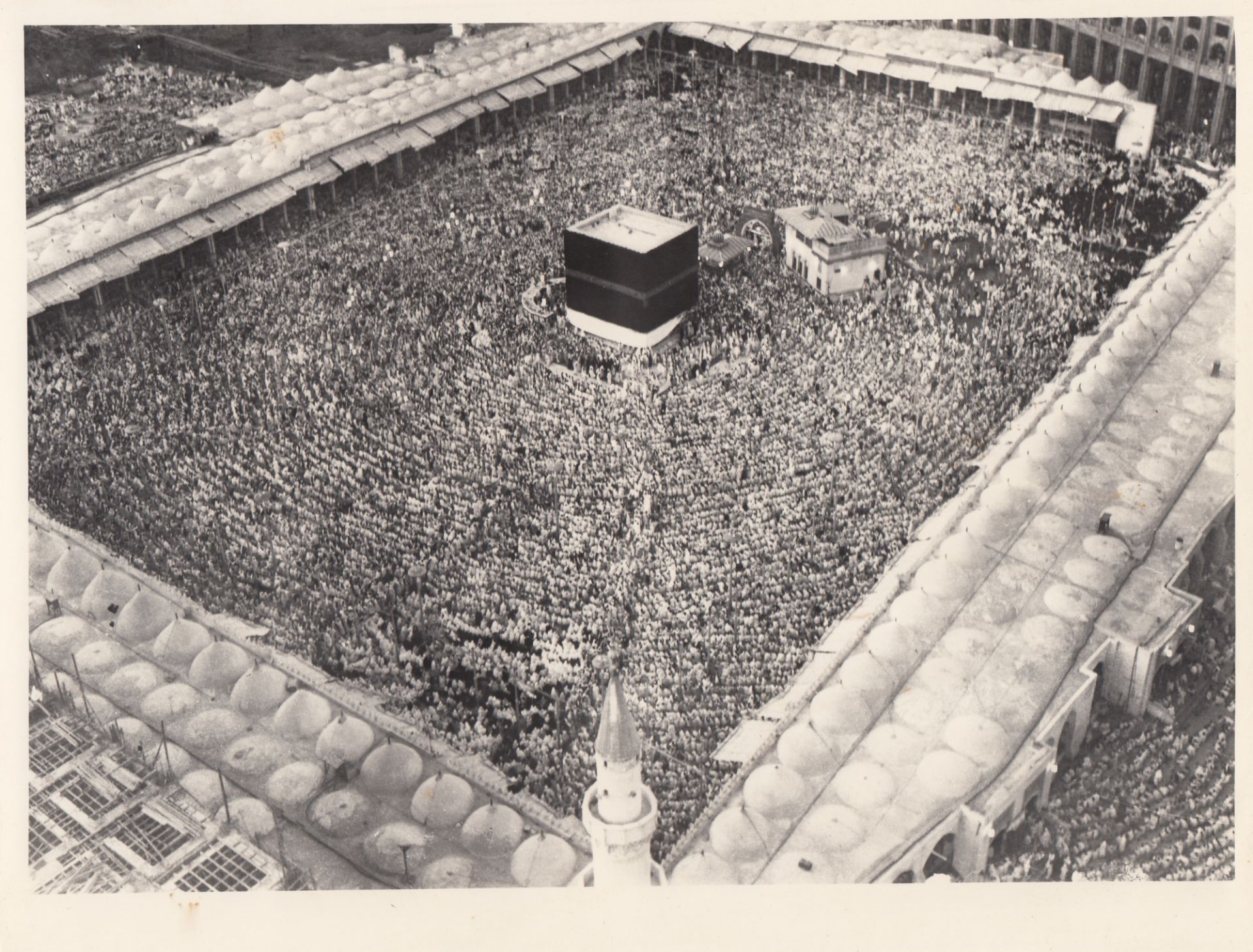FOURTEEN RARE PHOTOGRAPHS OF THE FIRST EXPANSION OF THE MASJID AL-HARAM DURING KING SAUD BIN ABDULAZ