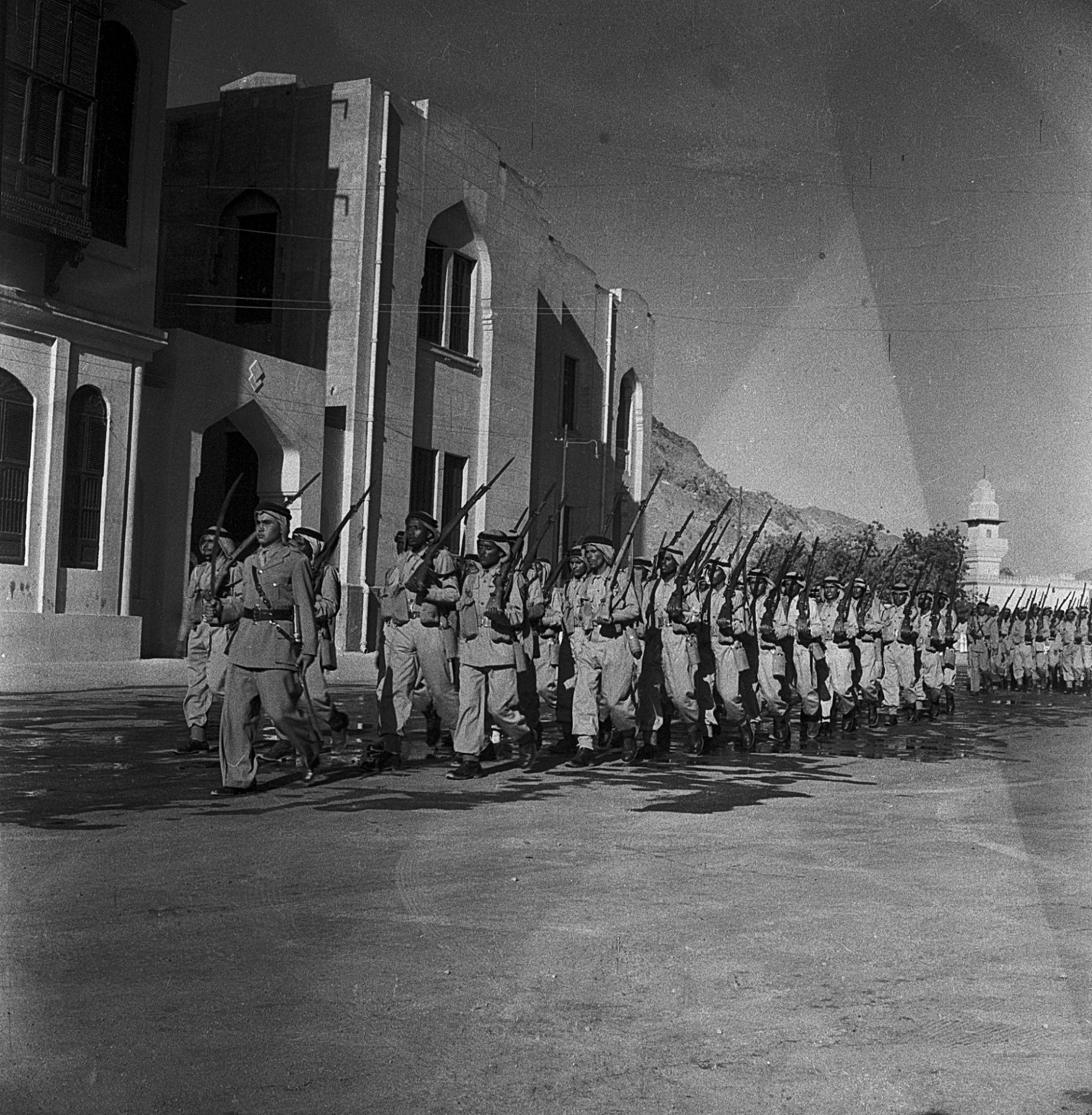 A COLLECTION OF SIX PHOTOGRAPHS OF THE SAUDI ARMY COMMANDERS, OFFICERS AND SOLDIERS DURING A PARADE,