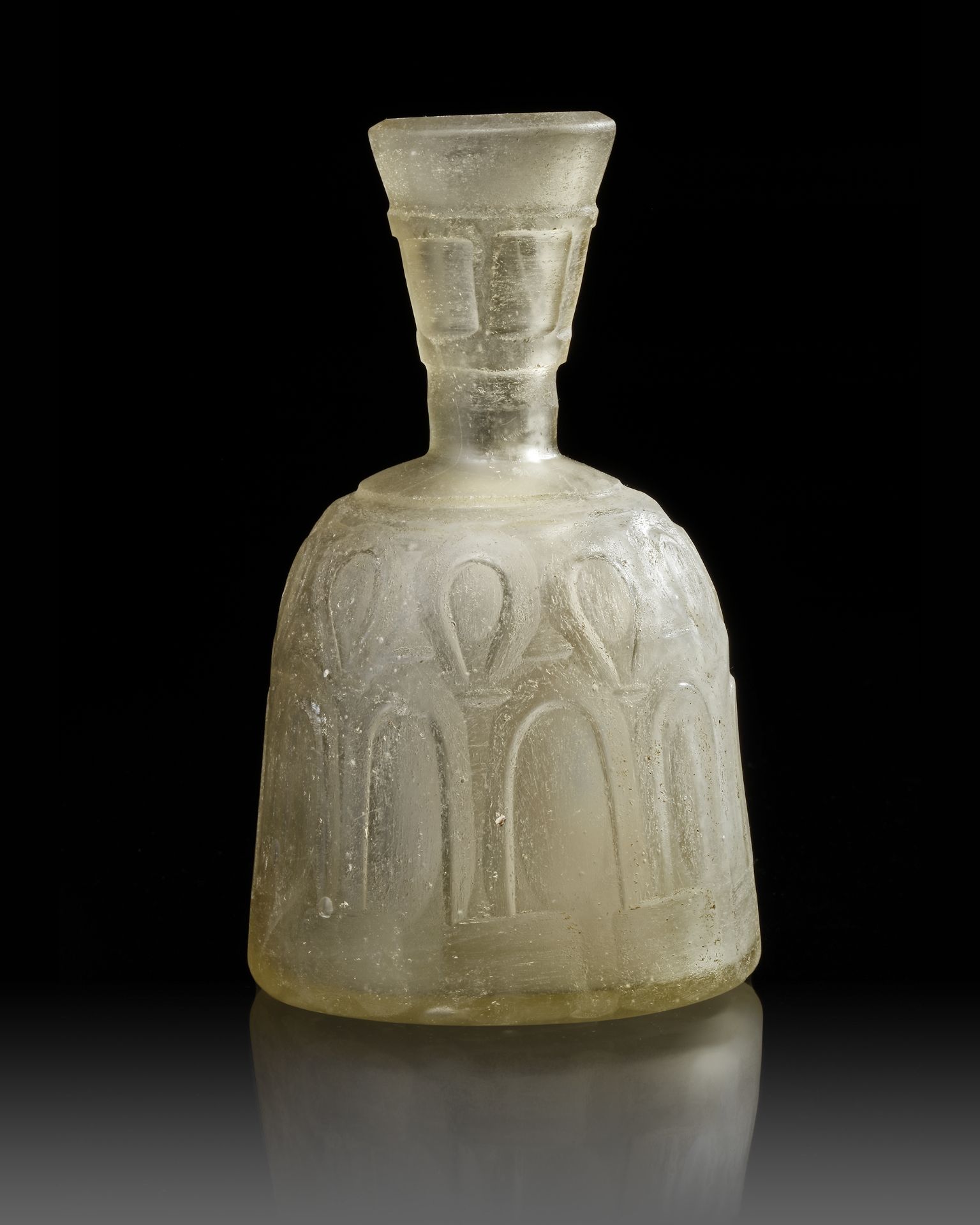 A WHEEL-CUT CLEAR GLASS BOTTLE NORTH EAST PERSIA, 9TH-10TH CENTURY