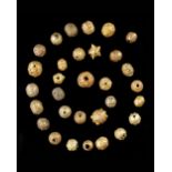 A FATIMID COLLECTION OF ORNATE GOLD BEADS, 11TH-13TH CENTURY