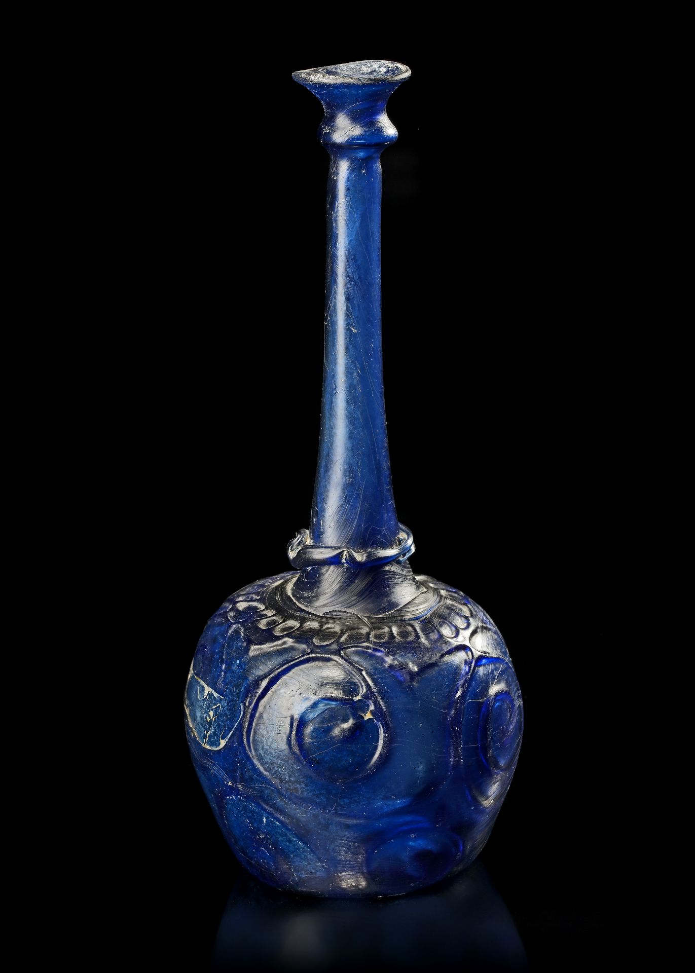 A LARGE MOULD-BLOWN BLUE GLASS BOTTLE-VASE OR SPRINKLER, PERSIA, 12TH CENTURY