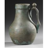 AN UMAYYAD BRONZE EWER, MESOPOTAMIA, 8TH-9TH CENTURY