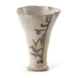 AN ABBASID CALLIGRAPHIC POTTERY CUP, MESOPOTAMIA, 9TH CENTURY