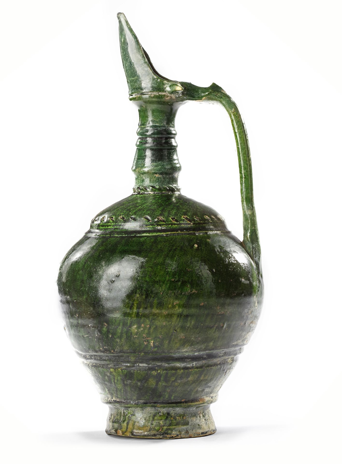 A UMAYYAD GREEN GLAZED POTTERY JUG, EASTERN MEDITERRANEAN, 8TH-9TH CENTURY